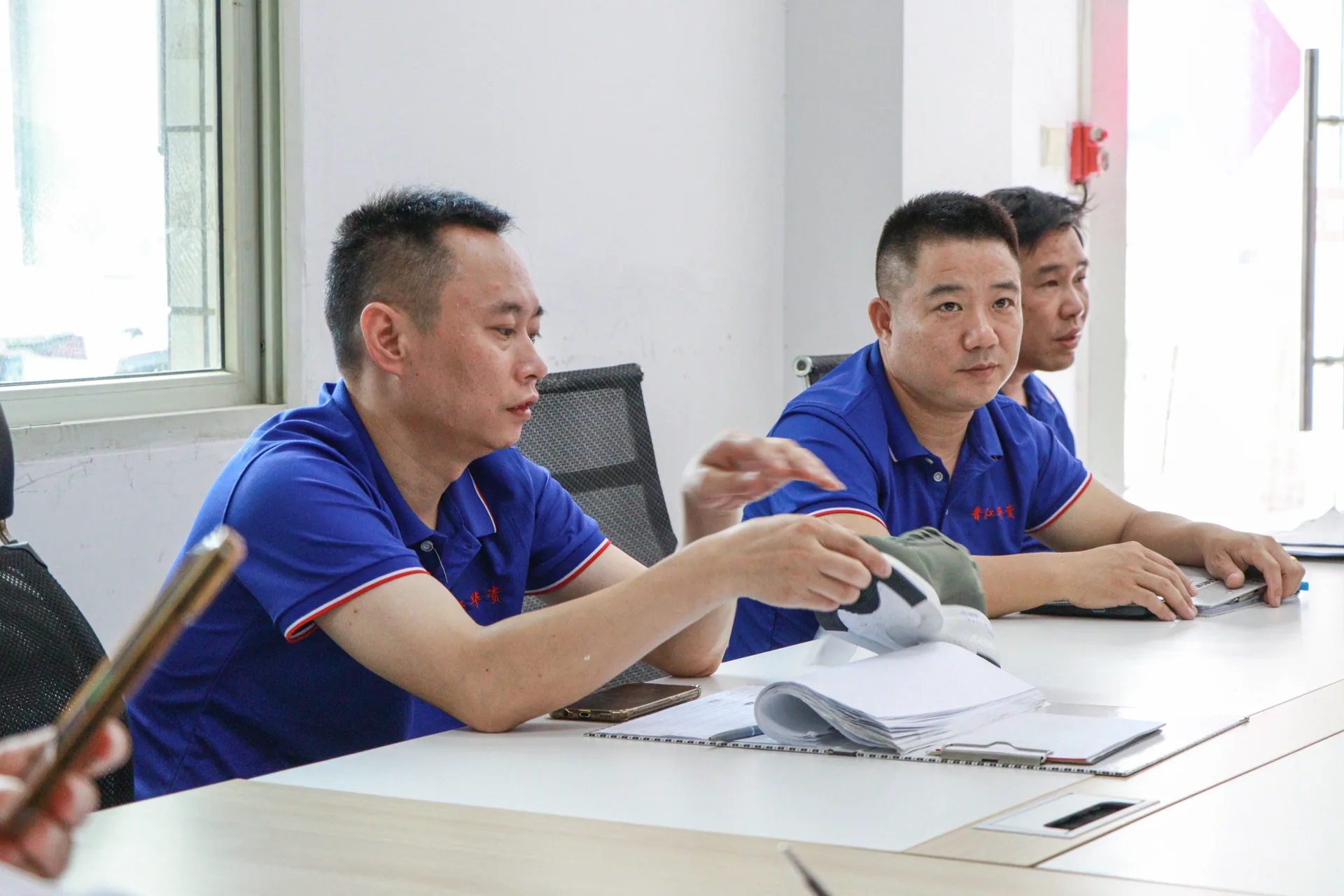 Team reviewing a footwear sample